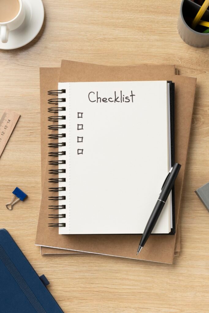 Work Permits for Third-Country Nationals 2 flat lay notebook with list desk 1