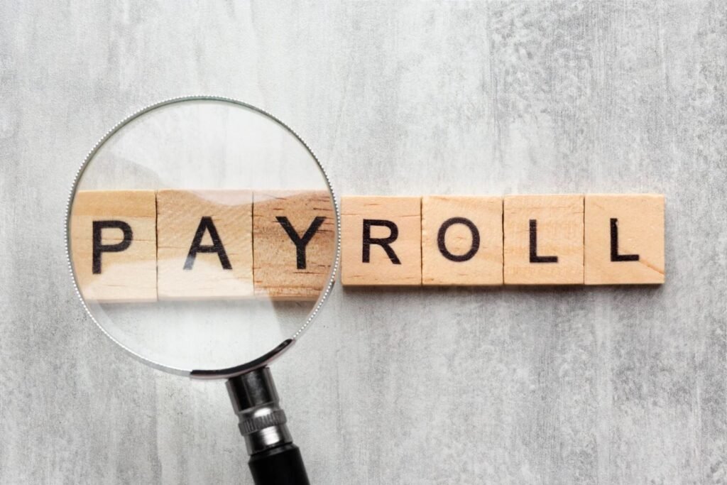 top view payroll concept with wooden cubes scaled 1