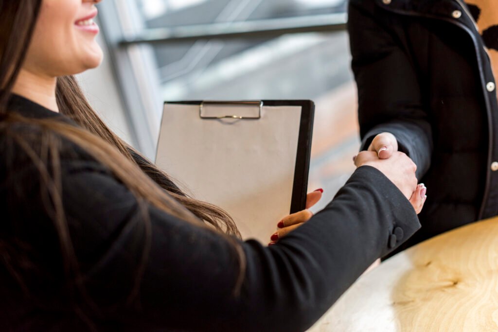 Before You Sign: The Employment Contract Essentials In Malta 2 brunette businesswoman making negotiation