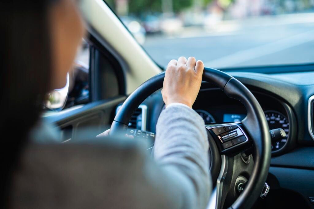 The Two Sides of Malta’s Roads 4 businesswoman driving her car city