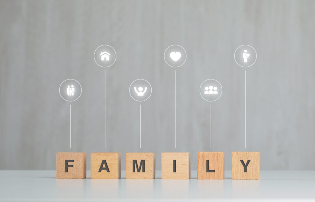 Family Benefits You Can Expect This December 2 family concept with wooden cubes icons grey white table side view