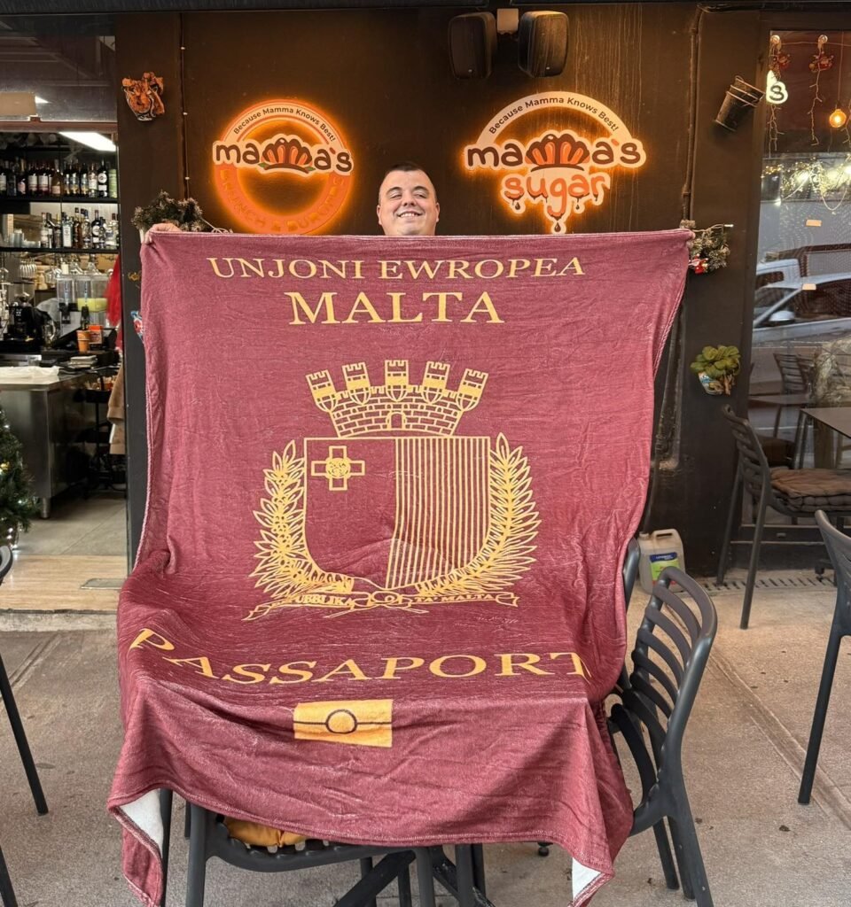 Alen osman holding a banner