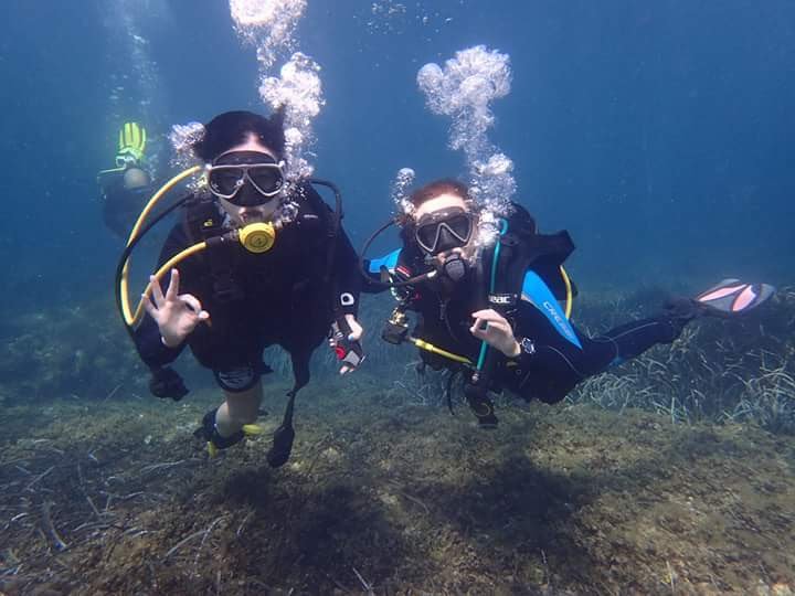 me to the right in blue with a student in 2016